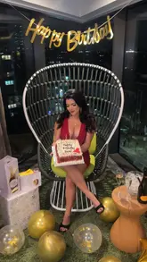 A promotional video showcasing a birthday stay at a London penthouse hotel. The video features a tour of the room, the view, the birthday decorations, and some food and drinks served in the room.
