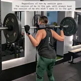 Fitness enthusiast celebrating gym wins with a personal trainer and photographer at a workout session.