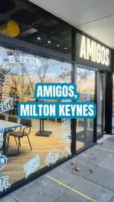 Burger and shake feast at Amigos Burgers in Milton Keynes, featuring buttermilk chicken and a tasty Skittles shake.