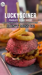 A promotional montage for the opening of Lucky's Diner in Glasgow, featuring shots of their burgers, wraps, wings, and fries, alongside interior shots of the restaurant's neon-lit, diner-style decor.