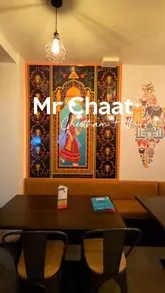 A promotional video for the new Mr Chaat branch in Cheetham Hill, featuring a variety of Indian street food, Desi Chinese dishes, and traditional curries. The video uses a montage format to showcase the restaurant's interior, menu, and a wide selection of dishes, accompanied by a voiceover describing the experience.