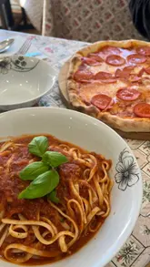 Enjoying authentic halal Italian cuisine at Tomi Pizza in Cardiff, with a cozy atmosphere and delicious dishes.