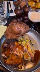 A montage video showcasing the Sunday roast and cocktail menu at The Adam & Eve pub in Homerton, featuring close-ups of the food, drinks, and the venue's interior.