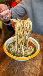 The creator tests ChatGPT's recommendations for Cambodian food in London, visiting two venues: Barang and Mamapen. The video features a mix of food close-ups, interior shots, and the creator's reactions to the dishes.