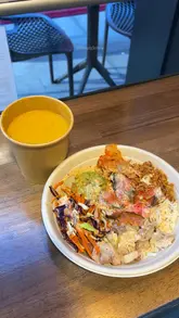Colorful protein salad bowls and warm soup at Tossed UK, perfect for gym-goers seeking healthy lunch options.