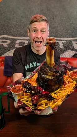 BBQ enthusiasts tackle the Undefeated 'Thor's Hammer' Challenge at Burnout BBQ Catering in Oxford, UK.