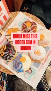 A montage showcasing various filled donuts and drinks at a cafe in London, highlighting the variety of flavours and the cafe's aesthetic.