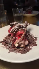 A review of a set menu deal at Hawksmoor in Edinburgh, showcasing various dishes including steak, chicken, and dessert, along with cocktails.