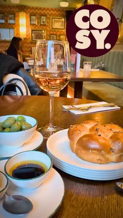 Dining at Cosy Club Sheffield with friends, enjoying Monkey Bread and Cherry Bakewell cocktails in a stylish atmosphere.