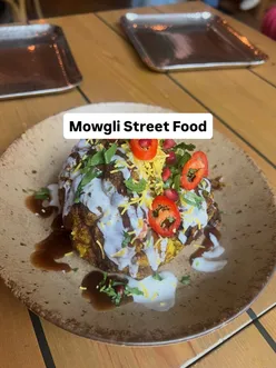 Delicious winter dishes at Mowgli Street Food in Cheshire Oaks, featuring Diwali Cauliflower and comforting Butter Chicken.