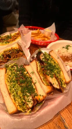 Delicious stuffed sandos served at No Drama in West London, showcasing great vibes and fantastic food.