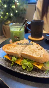 Enjoying coconut matcha lattes and a bulgogi beef sandwich at Fluffee, Clerk Street, with a corgi by our side.