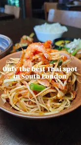 A short, punchy review of a Thai restaurant located in a railway arch, featuring close-ups of various dishes, cocktails, and the creator enjoying the food.