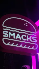 Delicious Smackdown burger with bacon, ice cream sandwich, and smoky fries at eat_smacks during January's 50% off event.