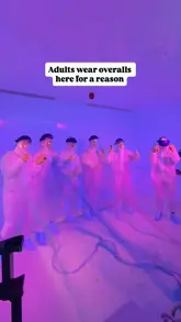 A fast-paced, energetic video showcasing an immersive gaming experience at Boom Lab in London. The video features a group of adults in white overalls participating in various high-energy, competitive team challenges, highlighting the chaotic and fun atmosphere of the venue.