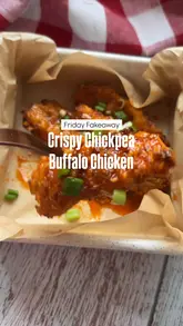 Buffalo crispy chickpea chicken strips served with spicy sauce and garlic dip, a healthy gluten-free alternative.
