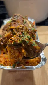 A short video review of a takeaway spot near Abbey Wood station, highlighting the one-man-band operation and the Mexican rice with chicken dish.
