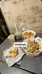 A short, energetic video showcasing the breakfast and lunch offerings at a Chaiiwala branch. The video features quick cuts of the menu, the interior decor, and close-ups of various dishes including roti wraps, hash browns, karak chai, and rice bowls.