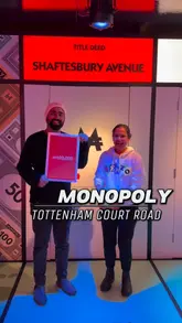 The video provides a tour of the Monopoly Lifesized venue in London, showcasing the various game rooms, the interactive board, and the overall atmosphere of the experience. It features participants engaging in the game and enjoying the venue's facilities.