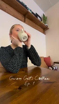 Cozy interior of Moth Coffee in Llanelli, showcasing vibrant decor and patrons enjoying coffee in a welcoming atmosphere.