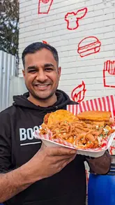 A fast-paced, enthusiastic review of a Nashville-style chicken restaurant in Leicester, showcasing a variety of dishes including loaded fries, tacos, burgers, and dessert.