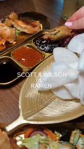 A promotional reel for Scott & Wilson featuring their new ramen dishes, stir-fry options, spring rolls, and cocktails. The video uses a montage format with music and text overlays to highlight the menu and the venue's interior.