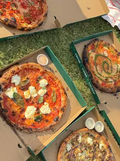 Delicious doughballs and pizzas at Pizza Laundry, showcasing unique flavors and affordable prices in London.