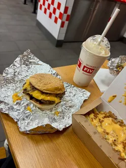 Delicious bacon & cheese burger with loaded fries and a chocolate milkshake at Five Guys, Bracknell.