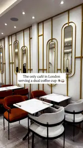 A promotional video for Nour Cafe in London, showcasing their unique dual coffee cups and a variety of brunch dishes including steak baguette, prawn brioche, full English breakfast, chicken schnitzel, pancakes, French toast, waffles, and cheesecake.
