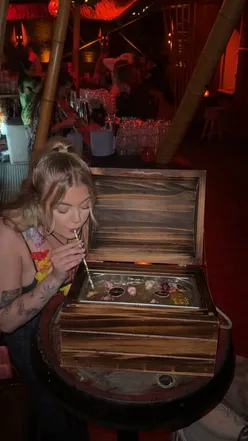 Charming cocktails at Tiki Hideaway, Leeds, featuring flaming Zombies and a treasure chest sharing drink.