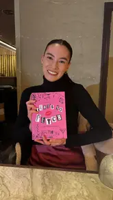 A promotional video showcasing a Mean Girls-themed cocktail experience at a venue. The video features clips of themed cocktails, branded props, and a drag queen performer, highlighting the fun, nostalgic atmosphere of the event.