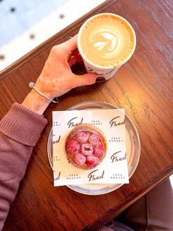 Enjoying quality coffee at Fred Bakery near Oxford Circus.