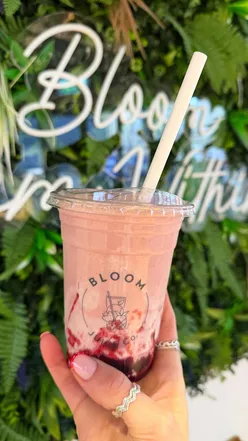 Delicious gut health smoothie from @bloomjuiceofficial featuring strawberries, bananas, and cherries in Leeds City Centre.