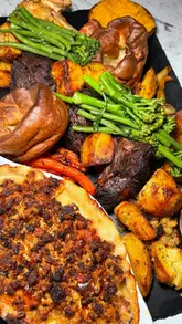 Sunday roast feast at Oxwich Bay Hotel in South Wales, featuring beef, chicken, and decadent desserts by the beach.