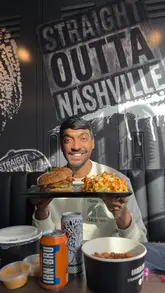 Delicious burgers from Straight Outta Nashville at an event in Bolton, featuring vibrant flavors and a lively atmosphere.