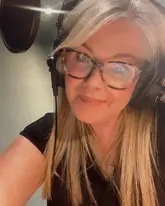 Lucy Alexander, TV presenter for A Place In The Sun and Homes Under The Hammer, smiling and discussing property and travel.