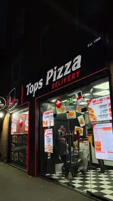A promotional video for Tops Pizza Manchester featuring quick cuts of pizza preparation, including dough handling, topping application, and the final product. The video highlights the freshness of the ingredients and the visual appeal of the pizzas, specifically showcasing cheese pulls and the cooking process.