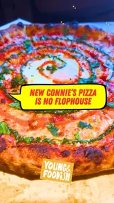 Andrea (Donndre) with a crisp, American-style pizza at Connie's Pizza, his new restaurant in Peckham.