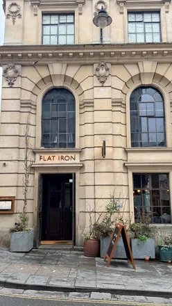 Flat Iron Steak restaurant in Bristol, showcasing a tender wagyu steak, tasty sides, and a complimentary ice cream.