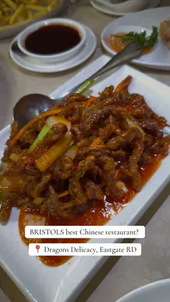 A delicious Chinese takeaway meal from Dragon's Delicacy in Bristol, featuring crispy duck, salt & chilli chips, and more.