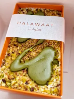Delicious creamy pistachio layered dessert from @halawaatuk, showcased in a vibrant food review by @brum.eats.