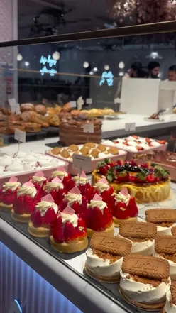 Delightful view of desserts at Elan Cafe in Westfield, London, with choices for followers to vote on their favorites.