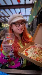 A creator visits Shipyard Street Food in Aberdeen, located within the Ivy Lodge venue. The video features a review of their pizza deals, specifically the 'Share the Deck' offer, while highlighting the lively atmosphere during a rugby match. The creator shows the menu, the food, and the venue's setting.