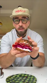 A polished, humorous recipe tutorial video demonstrating the process of making French onion bagels at home, presented by a creator in a 'trad dad' persona.