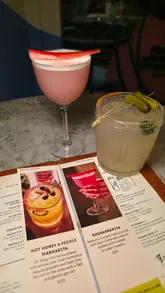 The video features a selection of cocktails and food dishes from Wahaca, specifically highlighting their 'Margarita Month' specials. It includes close-ups of the 'Hot Honey & Pickle Margarita' and 'Rhubarbarita,' alongside various Mexican dishes like tacos and dips, followed by a brief pan of the restaurant's interior.