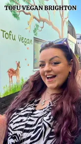New Tofu Vegan restaurant in Brighton, showing its bright, modern interior and inviting sunny patio area.