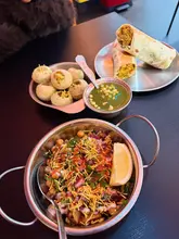 Vibrant Indian street food: samosa chaat, bhaji wrap, and pani puri from Snackwallah at Grainger Market, Newcastle.