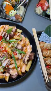 Delicious duck loaded fries and a dragon roll served at Inamo Restaurant in Kargo MKT.