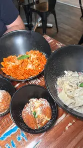 A short, engaging review of Pasticcio on Byres Road, highlighting their fresh, customizable pasta dishes, arancini, and tiramisu. The video features close-up shots of the food, a look at the menu, and the restaurant's interior, while mentioning a lunch deal and BYOB policy.