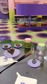 A short, aesthetic video showcasing a cafe and retail store hybrid in London, featuring matcha drinks, vegan desserts, and unique fashion accessories.